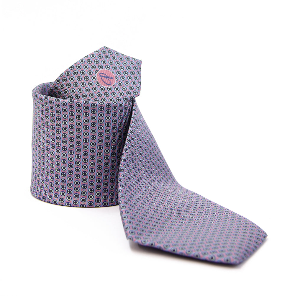 A purple tie with a geometric pattern of circles and dots on a white background, displayed in a folded and unfolded configuration.
