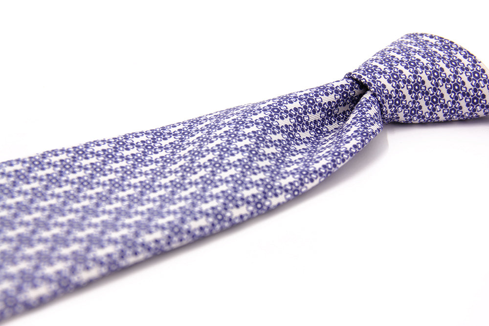 Detail of a blue silk tie geometric pattern