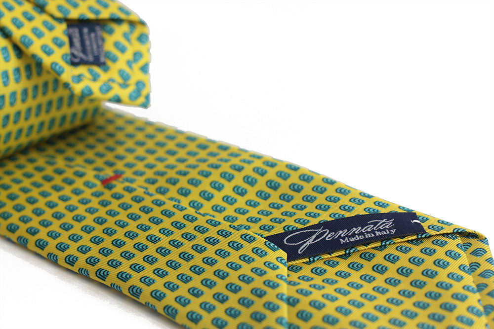Detail of a geometric silk tie green