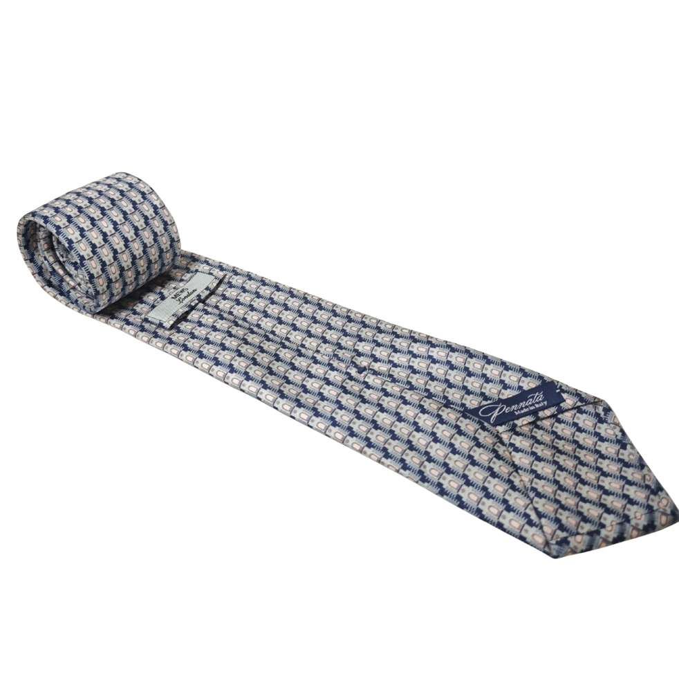 Light blue and white geometric patterned silk tie on a white background
