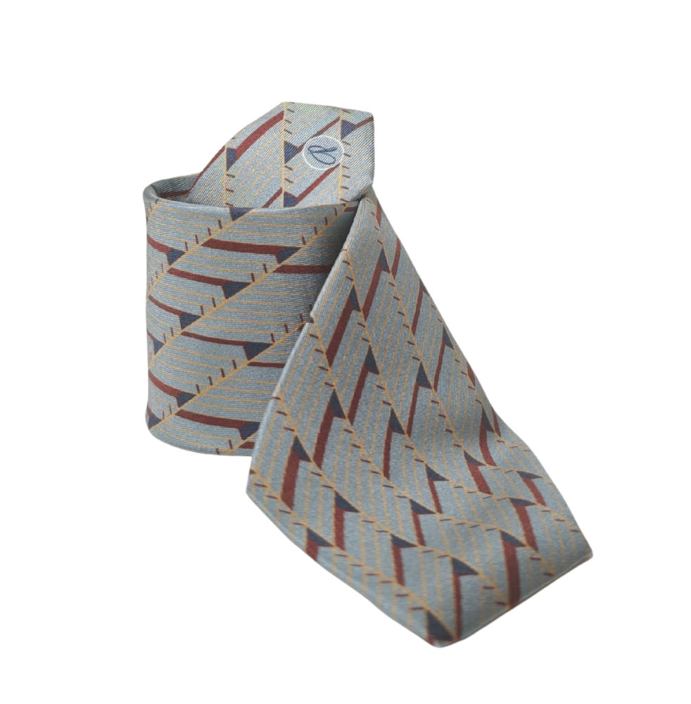 Patterned 100% silk tie on a white background