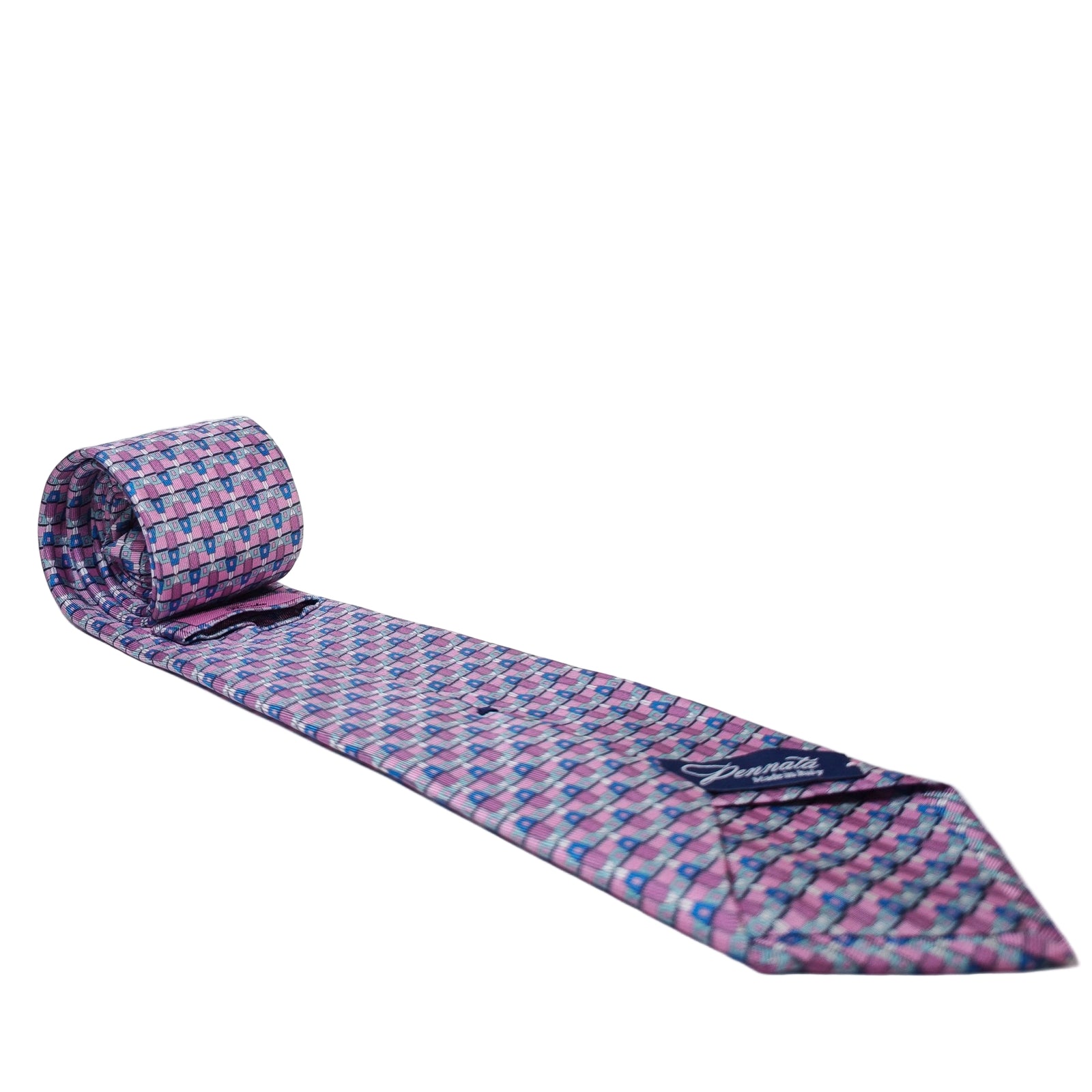 Rolled-up patterned silk tie with Pennata brand label on a white background