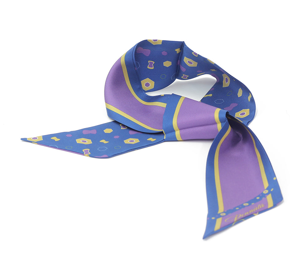 A purple silk twilly with a geometric pattern and a solid blue stripe along one edge.