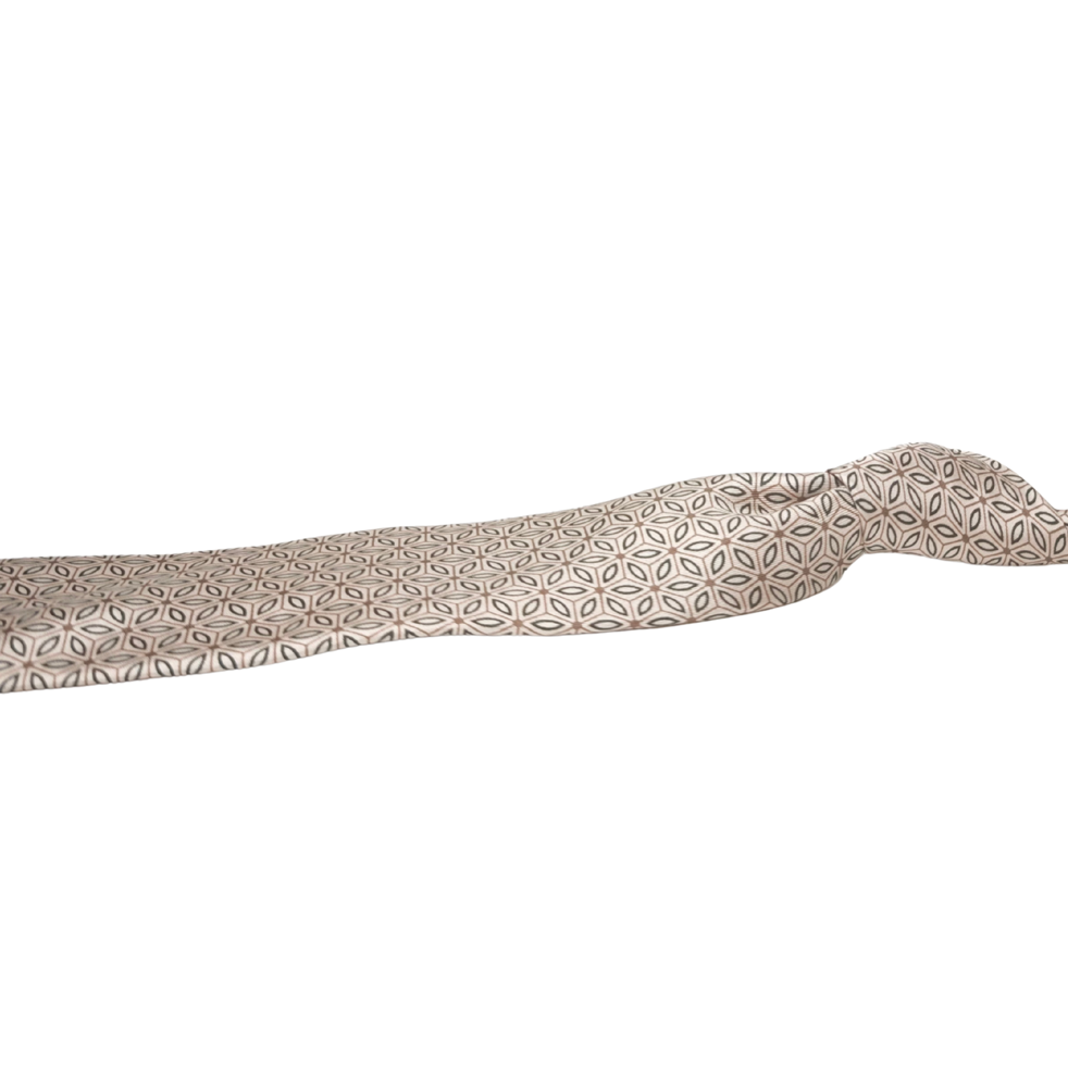 Patterned silk tie on a white background