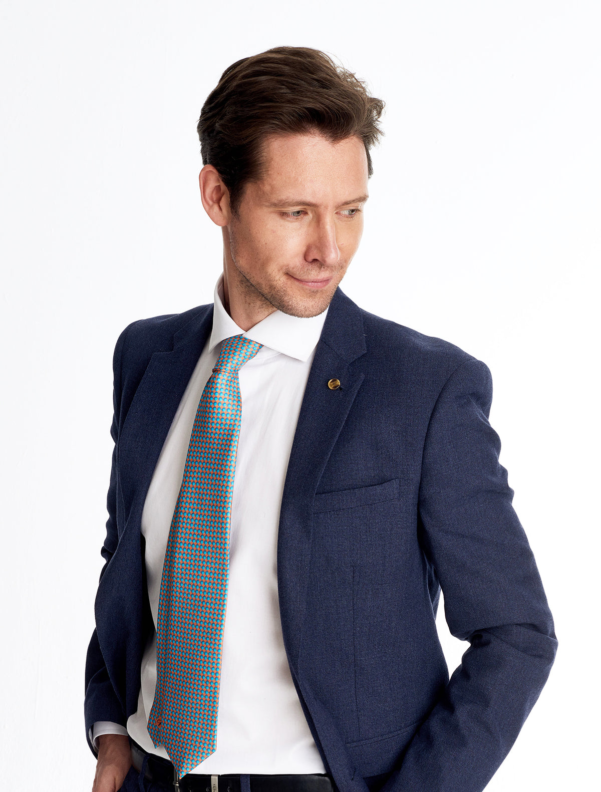 Elegant man wearing geometric blu purple silk tie 