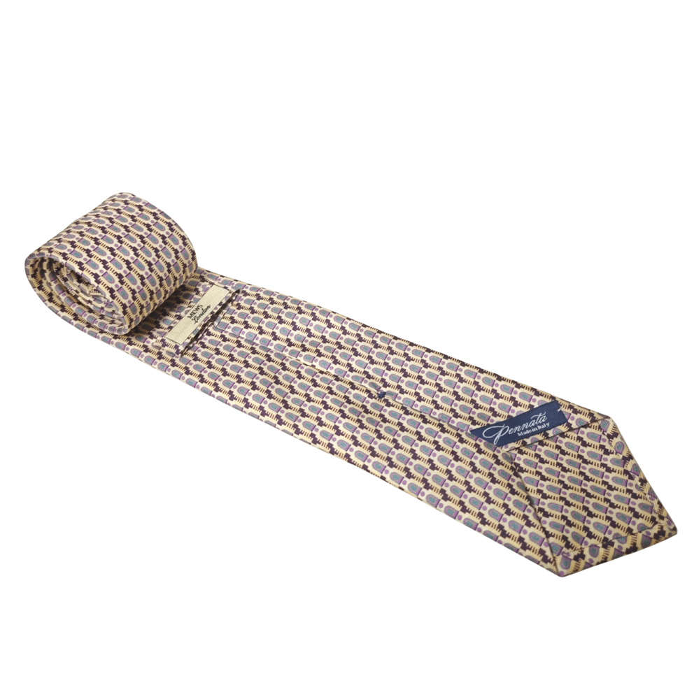 Patterned gold silk tie with a brand label on a white background