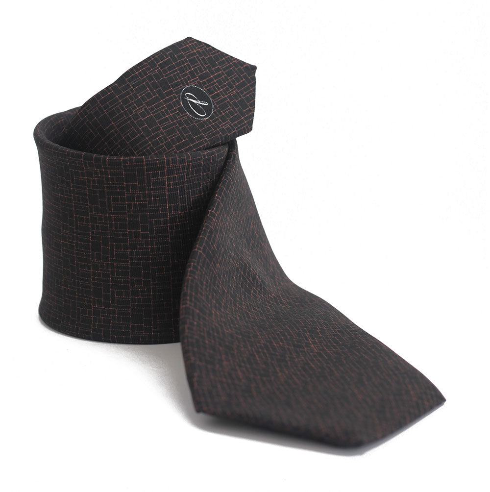 A black silk bow tie with a textured pattern, displayed in a folded position, showing the side with the label visible.