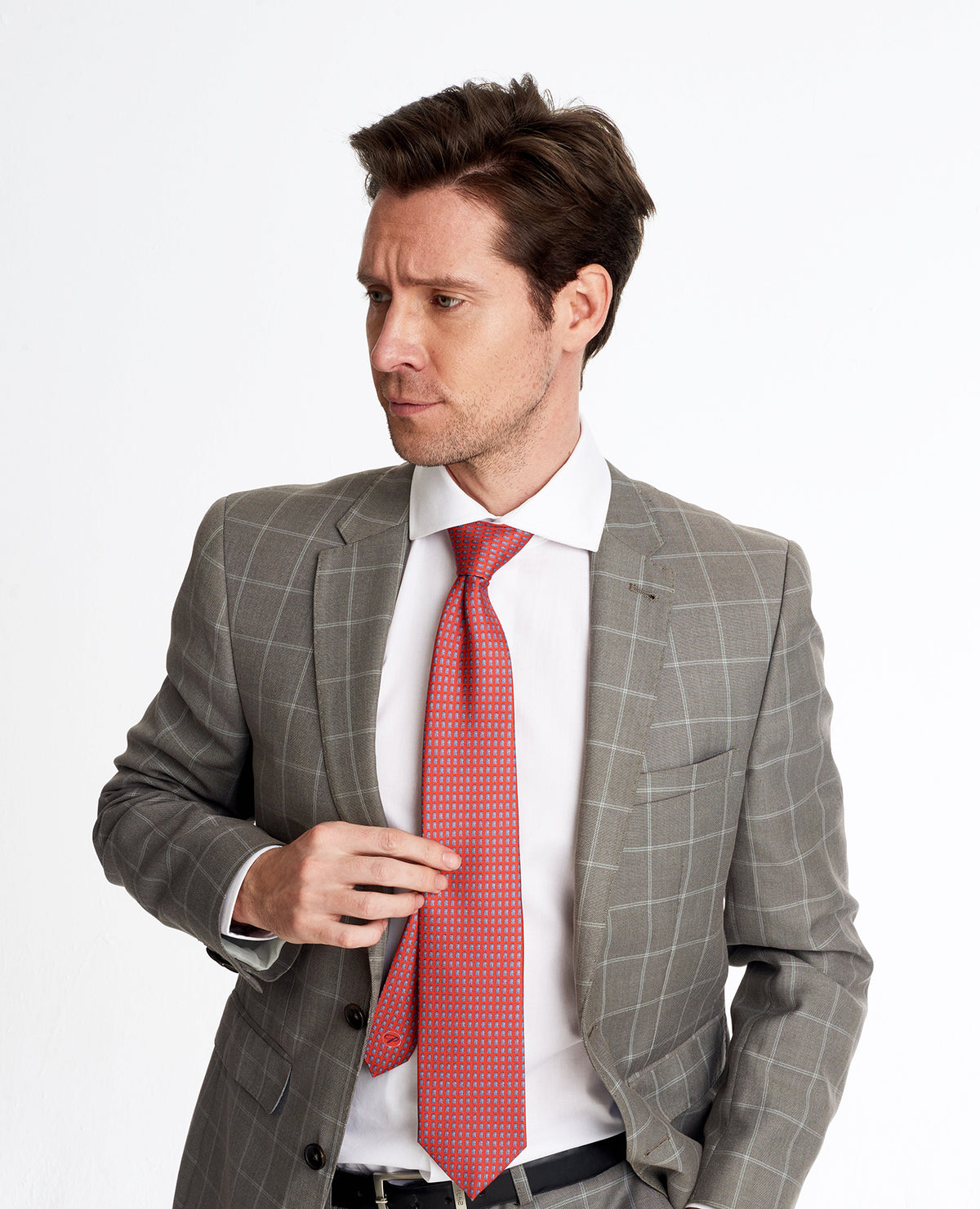 Young elegant man wearing a silk tie_square colosseum red designers 