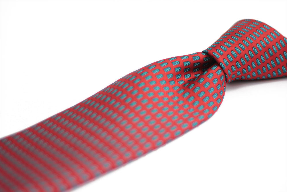 Detail of a red silk tie geometric pattern