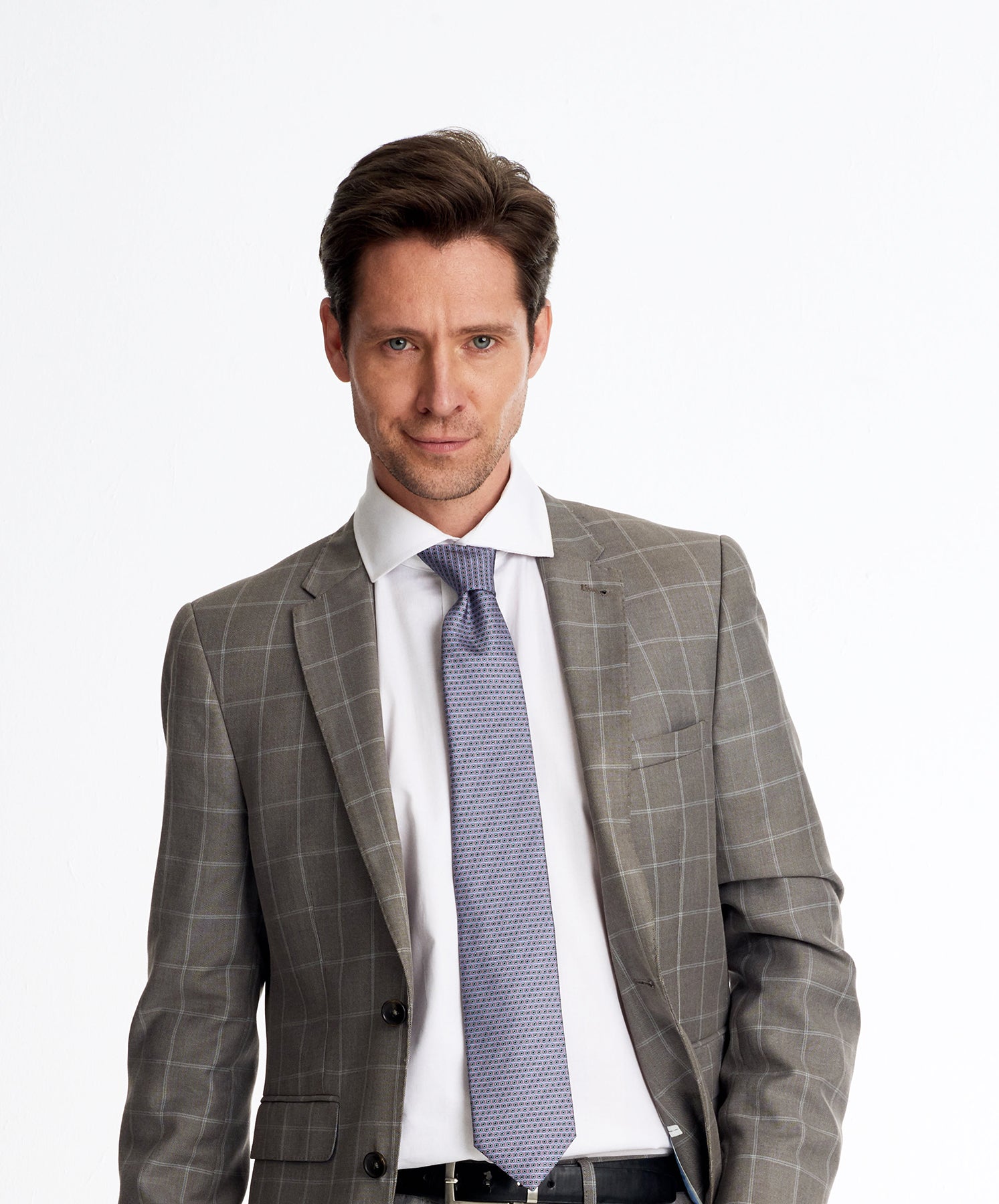 Man wearing a designers geometric silk tie 